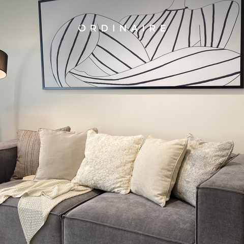 Decorate the sofa with colorful pillows and blankets